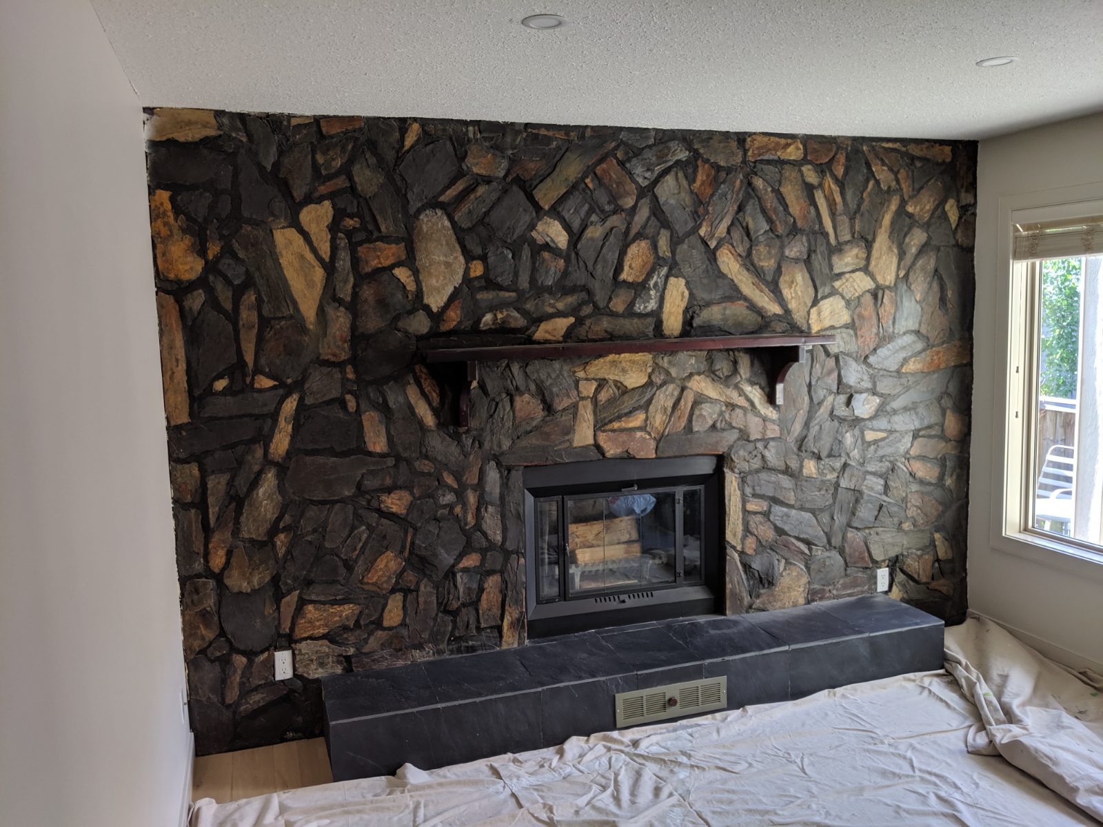 Stone fireplace feature wall repaint, North Edmonton