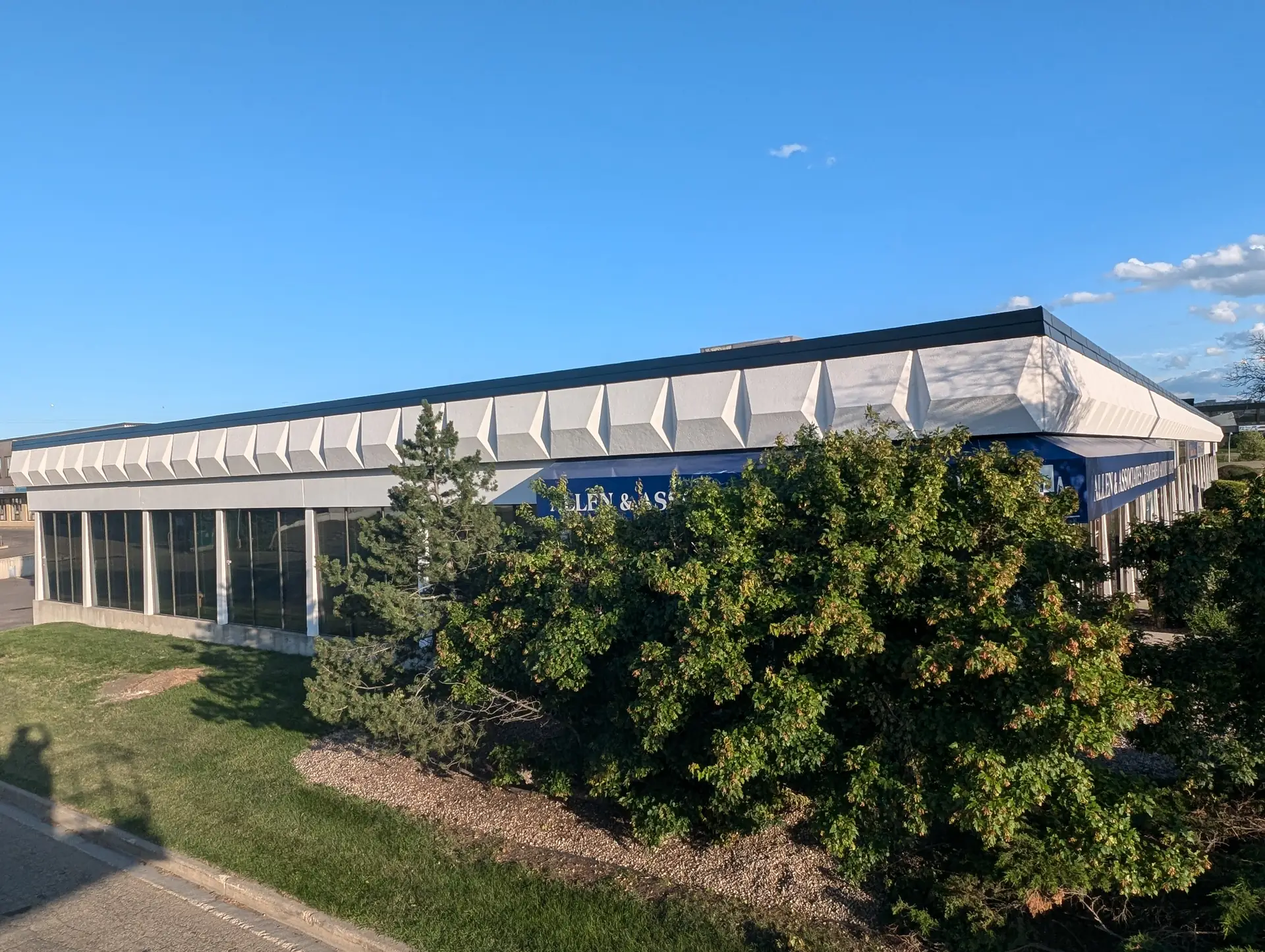 Alpine crew repainting a commercial stucco exterior in South Edmonton