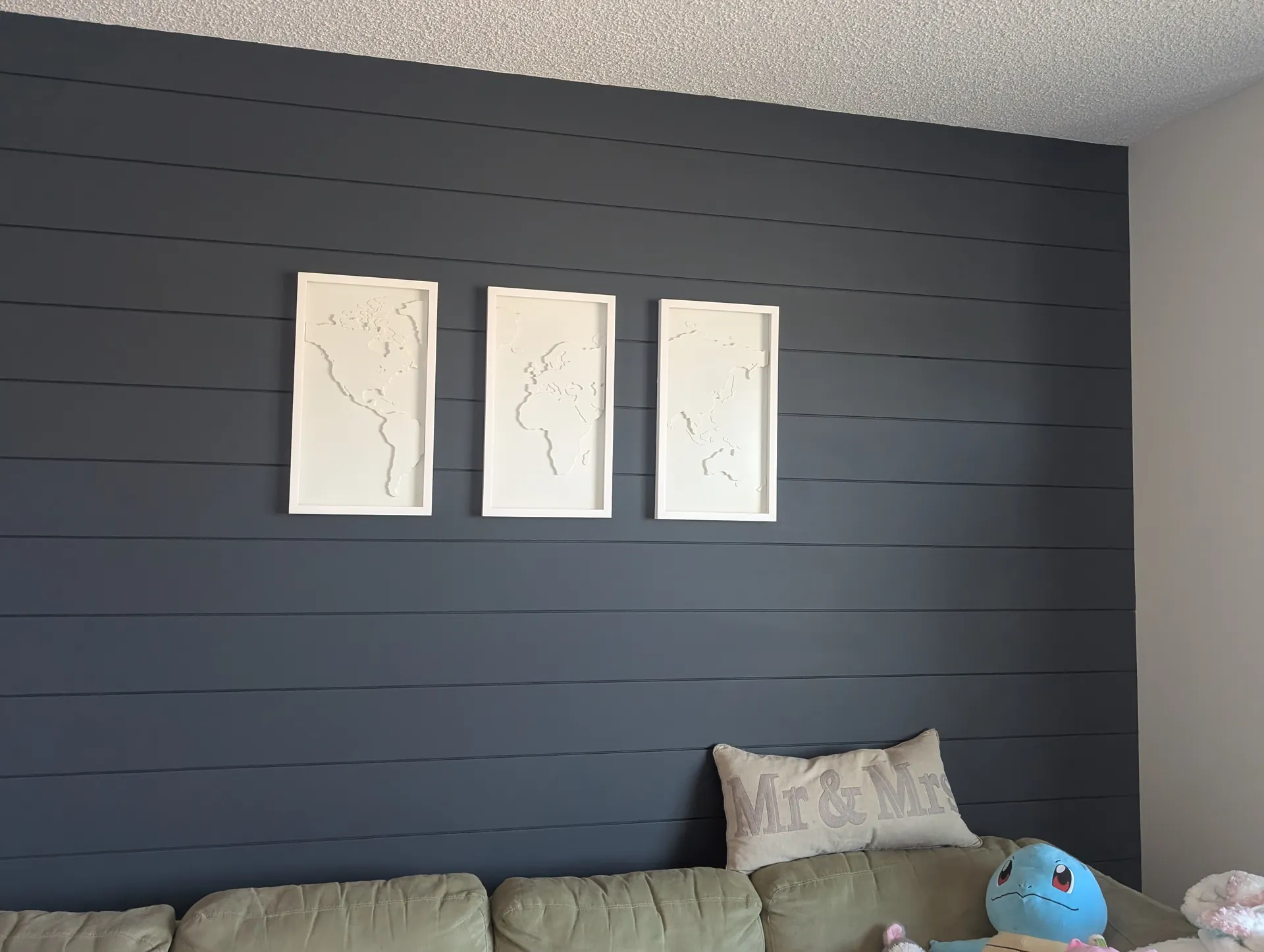 Finished navy shiplap feature wall in a styled living room, Edmonton